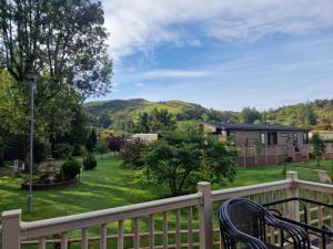 a balcony with a view of a yard at Maple 2 Bedroom Luxury Lodge in Mid Wales in Welshpool