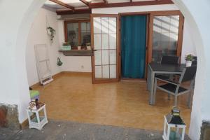 a room with a desk and a table in a room at Bungalow Luisy in Maspalomas