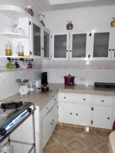 Kuchyň nebo kuchyňský kout v ubytování Hostal familiar Villa Nome