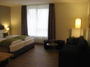 Postel nebo postele na pokoji v ubytování Hotel Kapellenberg
