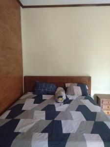Postel nebo postele na pokoji v ubytování Homestay Arupadhatu Borobudur