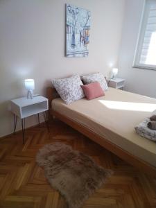 Postel nebo postele na pokoji v ubytování Cezar