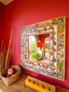 a mirror on a wall in a room at Rancho Parralito 