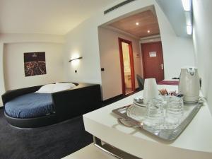 Uma cama ou camas num quarto em Best Western Hotel Class Lamezia
