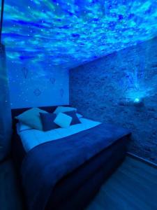 a bed in a room with a fish ceiling at Ein Stück Heimat mit Netflix in Bielefeld