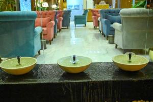 two bowls sitting on a counter in a store at جوهرة السراة للأجنحة الفندقية in Khamis Mushayt