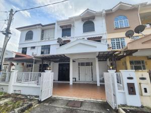 a white house with a white fence in front of it at Solok Burma Vacation Home @ Gurney Penang in George Town