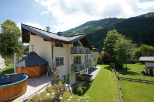 an aerial view of a house with a yard at Alpinchalet Eder - Steiner in Saalbach Hinterglemm