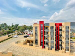 een weergave van de buitenkant van een gebouw met rode zuilen bij Rose Garden Private Apartment By LINK in Kigali