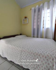 Кровать или кровати в номере Casa de praia Cantinho dos pássaros