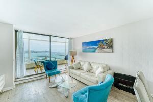 a living room with a couch and a table at Bay Dream 2B W/Wifi, Grill & View. in San Antonio