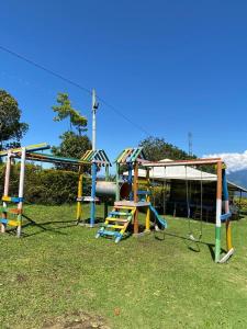 a group of playground equipment in a park at Finca Vacacional Guanani in Socorro