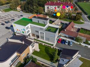 an overhead view of a house with a parking lot at Arcobaleno Apartments & Rooms in Varaždin