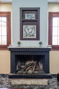 a fireplace in a living room with a fire place at Oceanviewvilla in Karpathos