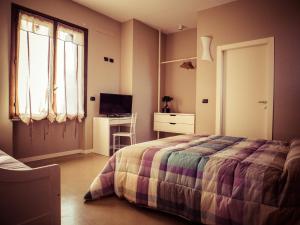 TV a/nebo společenská místnost v ubytování B&B Aurora