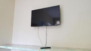 TV a/nebo společenská místnost v ubytování Pousada Portal das Flores + 22 fotografií