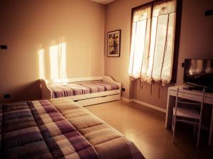 Postel nebo postele na pokoji v ubytování B&B Aurora