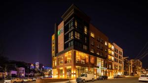a building on a city street at night at Holiday Inn Express & Suites - Charlotte - South End, an IHG Hotel in Charlotte