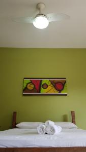 Postel nebo postele na pokoji v ubytování Pousada Portal das Flores