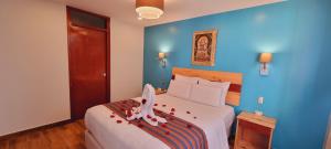 Ένα ή περισσότερα κρεβάτια σε δωμάτιο στο HOTEL LUZ GARDEN
