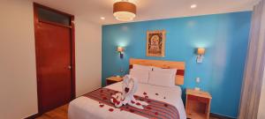 Ένα ή περισσότερα κρεβάτια σε δωμάτιο στο HOTEL LUZ GARDEN