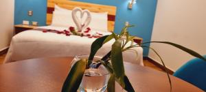 Ένα ή περισσότερα κρεβάτια σε δωμάτιο στο HOTEL LUZ GARDEN