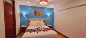 Ένα ή περισσότερα κρεβάτια σε δωμάτιο στο HOTEL LUZ GARDEN