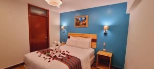 Ένα ή περισσότερα κρεβάτια σε δωμάτιο στο HOTEL LUZ GARDEN