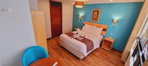Ένα ή περισσότερα κρεβάτια σε δωμάτιο στο HOTEL LUZ GARDEN