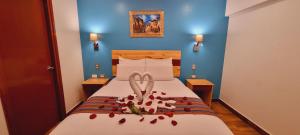 Ένα ή περισσότερα κρεβάτια σε δωμάτιο στο HOTEL LUZ GARDEN