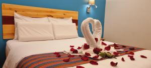 Ένα ή περισσότερα κρεβάτια σε δωμάτιο στο HOTEL LUZ GARDEN