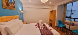 Ένα ή περισσότερα κρεβάτια σε δωμάτιο στο HOTEL LUZ GARDEN