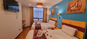 Ένα ή περισσότερα κρεβάτια σε δωμάτιο στο HOTEL LUZ GARDEN