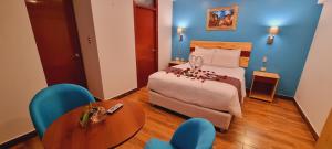 Ένα ή περισσότερα κρεβάτια σε δωμάτιο στο HOTEL LUZ GARDEN