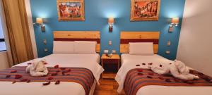 Ένα ή περισσότερα κρεβάτια σε δωμάτιο στο HOTEL LUZ GARDEN