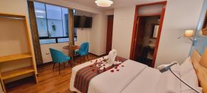 Ένα ή περισσότερα κρεβάτια σε δωμάτιο στο HOTEL LUZ GARDEN