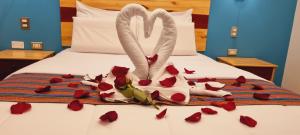 Ένα ή περισσότερα κρεβάτια σε δωμάτιο στο HOTEL LUZ GARDEN