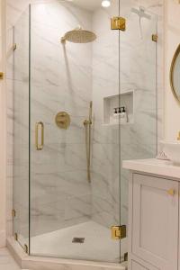 a shower with a glass door in a bathroom at Home in the heart of willow Glen San Jose in San Jose