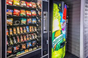 a vending machine filled with lots of food and drinks at Motel 6-Greensboro, NC - I-40 in Greensboro