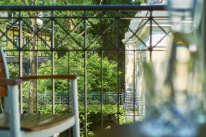 a view of a window with a table and chairs at Maison Messmer - ein Mitglied der Hommage Luxury Hotels Collection in Baden-Baden