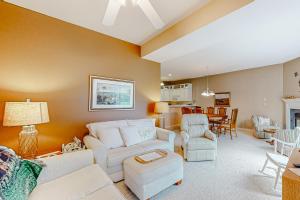 a living room with a white couch and chairs at Salt Pond -- 23 Topsail Village in Bethany Beach