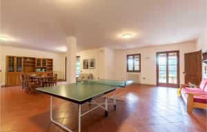 a ping pong table in the middle of a living room at Castello Di Tocerano in Monte Santa Maria Tiberina