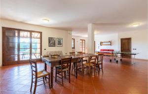 a dining room with a large table and chairs at Castello Di Tocerano in Monte Santa Maria Tiberina