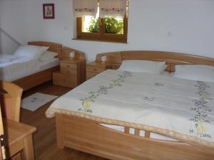 A bed or beds in a room at Tourist Farm Ob izviru Krupe