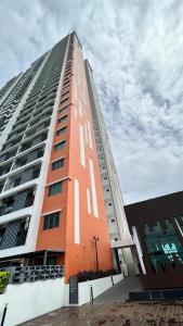 a tall building with the words va on it at D Naurah Meritus Guesthouse in Perai