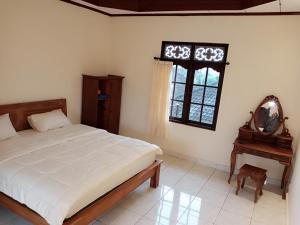 Postel nebo postele na pokoji v ubytování WAH TEJA HOMESTAY + 57 fotografií