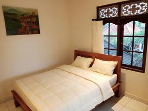 Postel nebo postele na pokoji v ubytování WAH TEJA HOMESTAY