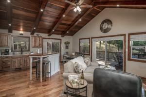 a living room with a couch and a table at Moon Mountain Escape in Ruidoso