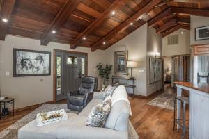 a living room with a couch and a table at Moon Mountain Escape in Ruidoso