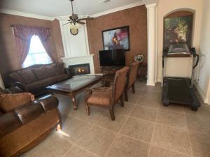 a living room with a couch and a table at AirBB Rooms in Mansion in Riverside